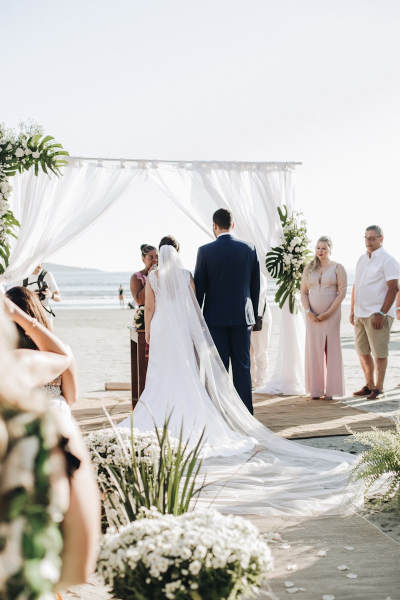 A couple being married beside the water